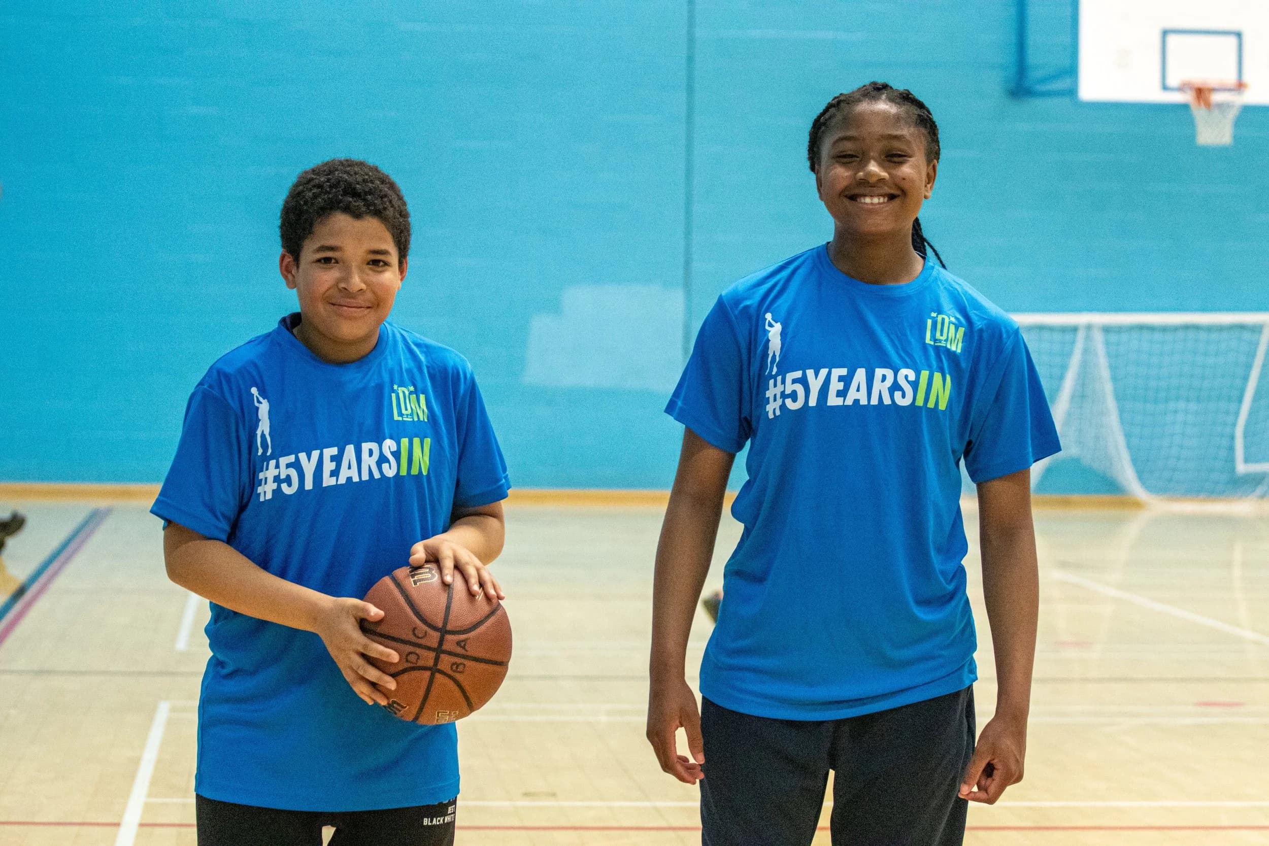 Two young LDM participants in a sports hall